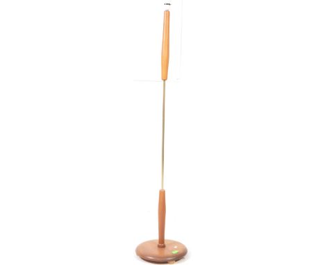 British Modern Design - A mid century teak and brass floor standing standard lamp. Circular wooden foot with central brass an