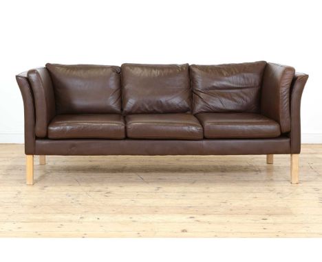 A Danish brown leather three-seater settee, by Hurup, raised on light beech supports, 200cm wide 80cm deep85cm high, seat 43c