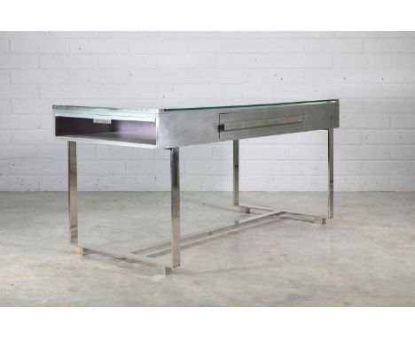 A brushed aluminium and chrome desk, 1970s, designed by Raymond Cohen, with a glass top, over a single wide drawer, each side