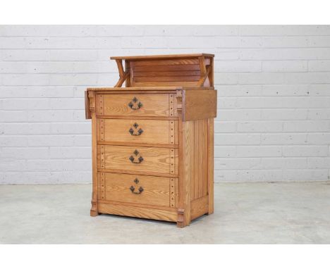 A Gothic Revival-style oak dresser,early 20th century, in the manner of AWN Pugin, the top with a drop-leaf to each side, the