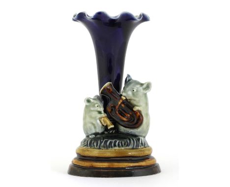 A Doulton stoneware 'Mouse Musicians' spill vase,by George Tinworth, modelled as a larger mouse playing a tuba, the smaller m