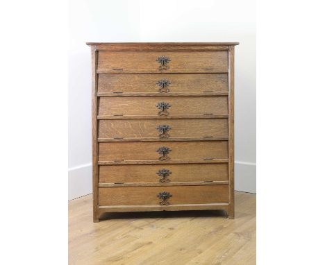 An Arts &amp; Crafts oak chest,early 20th century, the rectangular top over six hinged hatches and a single frieze drawer to 