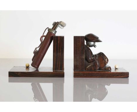 A pair of Art Deco novelty rosewood bookends,1930s, each mounted with either a caddy or a golf bag and an ivory ball, stamped