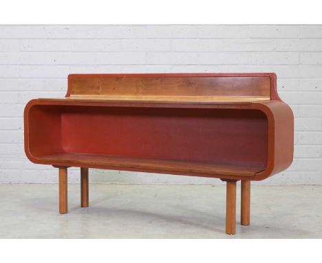 A yew wood wall-mounted open side cabinet, designed and made by John Makepeace, mounted with tan leather, labelled 'Designed 