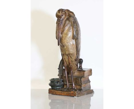 A Goldscheider terracotta inkstand, early 20th century, modelled as a marabou stork perched on top of a stack of books, decor