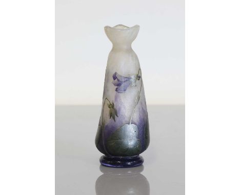 A Daum 'Violets' cameo glass vase, c.1900, cased and cut with flowering violets to a mottled ground, gilt signature to the ba