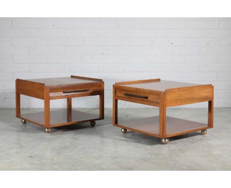 A pair of Dundar walnut side tables, designed by Edward Wormley, each fitted with a single drawer and a shelf below, raised o