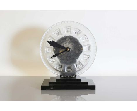 An Art Deco ATO Clock Company desk clock, with a moulded and frosted glass dial, moulded 'ATO', with a Léon Hatot electric mo