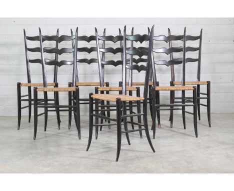 A set of eight ebonised Italian Chiavari chairs,1960s, each of ladder-backed construction, with a heart-shaped ladder over a 