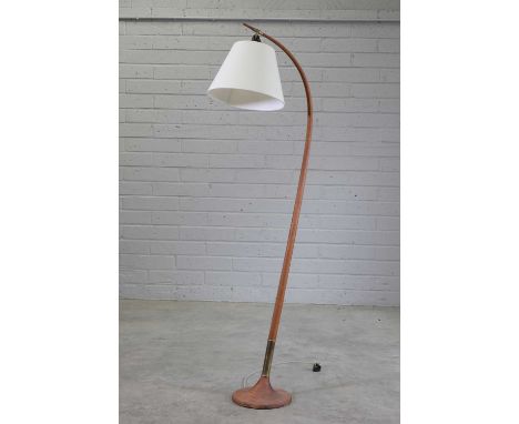 A Danish beech floor lamp,1950s, designed by Severin Hansen, with a brass-mounted swept stand, on a turned plinth, 153cm high