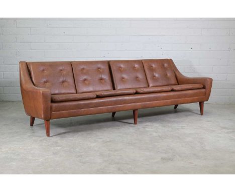 A Swedish four-seater sofa,1960s, designed by Folke Ohlsson for Dux, with squab seat and back cushions with buttoned detail, 