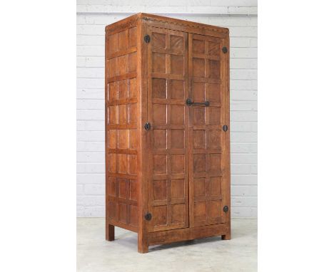 A Robert 'Mouseman' Thompson oak wardrobe, 1930s, with half penny moulding, wrought iron hinges with a latch with square key 