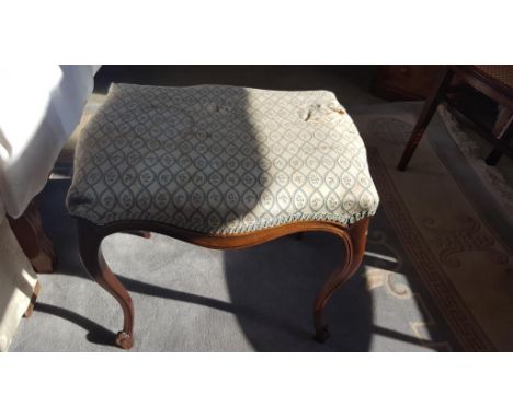 A Late 19th Century Walnut Dressing Stool with cabriole legs.