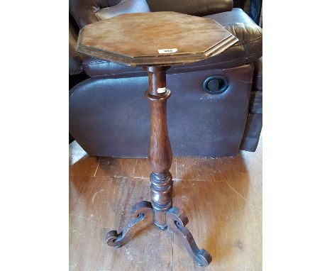 An Early 20th Century Pine Plant Stand, having an octagonal moulded top on a  turned support with tripod base.