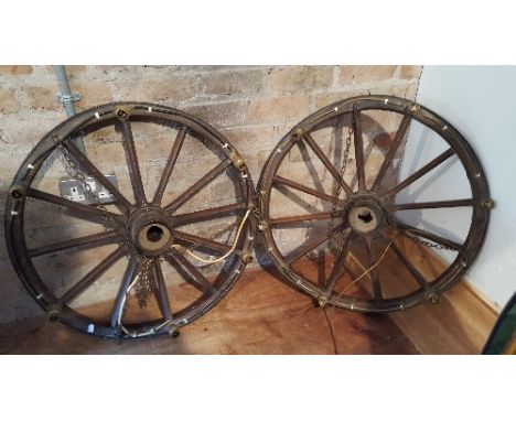 A Pair of Wooden Cart Wheels Converted into Light Fittings.