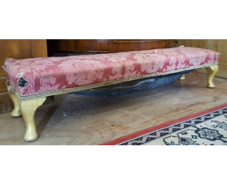A Late 19th/Early 20th Century Long Foot Stool, having a stuff over upholstered top.  