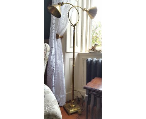 A Good Quality Brass Standard Lamp with two trumpet end shades, on a square stepped base.