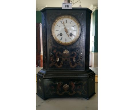A 19th Century French Ebonised Boulle Brass Inlaid Mantel Clock; the white enamel dial with Roman numerals.