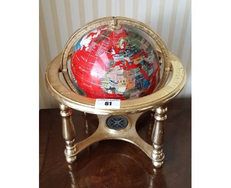 A 20th Century Brass Mounted Gemstone Globe, each country made from a different type of stone. 26cm (h).