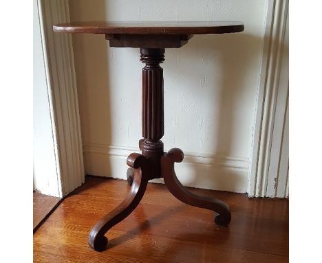 A 19th Century Mahogany Occasional Table with reeded column and scrolling tripod support.