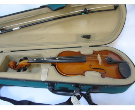 Green fabric cased violin and bow