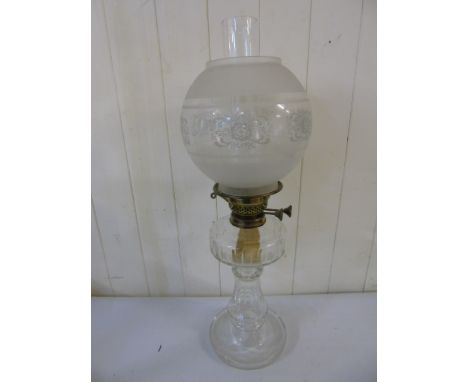 Clear glass oil lamp on glass base approx. 24" tall