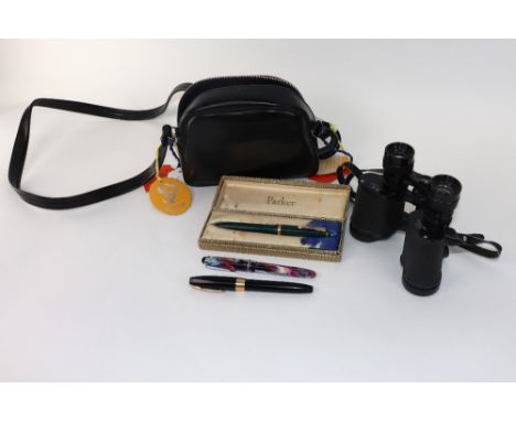 A Parker Maxima green and gilt fountain pen, boxed, another, a Sheaffer black and gilt white spot fountain pen and an Osmiroi
