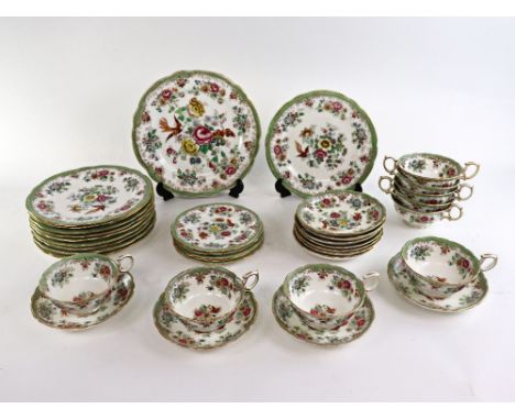 A Hammersley & Co part tea service to include: 9 tea cups, 11 saucers, 5 other saucers, 10 side plates and one larger plate (