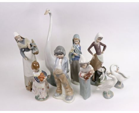 A group of nine Lladro figures; including three of geese, a girl with chicken, a girl with flowers, a girl with a basket of f