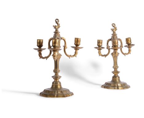 A PAIR OF LOUIS XV ORMOLU THREE-LIGHT CANDELABRA THIRD QUARTER 18TH CENTURYEach with dolphin finial above scrolling foliate d