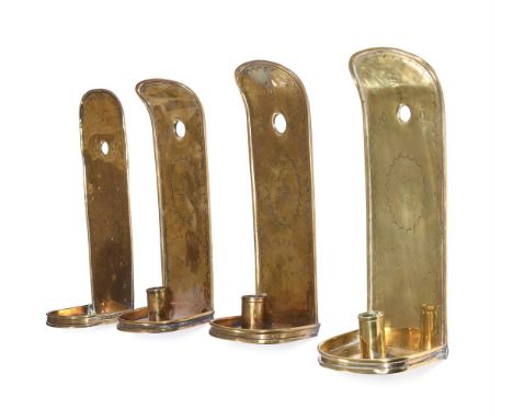ANOTHER SET OF FOUR EMBOSSED SHEET BRASS WALL SCONCES18TH CENTURYEach with backplate centred by a ship motif designeach 28cm 