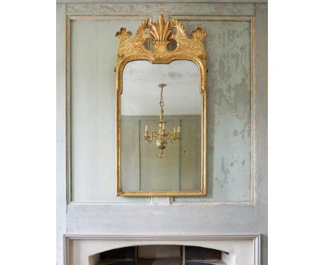 A GEORGE I GILTWOOD AND GESSO WALL MIRRORIN THE MANNER OF MOORE & GUMLEY, CIRCA 1720With bevelled Vauxhall glass plate113cm h