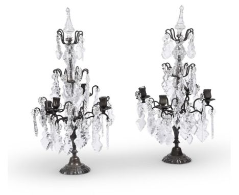 A PAIR OF PATINATED, MOULDED AND CUT-GLASS FOUR LIGHT CANDELABRAIN THE MANNER OF MAISON JANSEN, EARLY 20TH CENTURYeach 72cm h