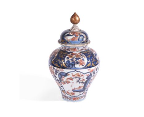 A JAPANESE ARITA VASE AND COVER EARLY 18TH CENTURY Of baluster form with domed cover and tapering finial, painted with panels