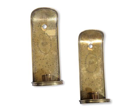 A PAIR OF EMBOSSED SHEET BRASS WALL SCONCES18TH CENTURYEach with backplate centred by a ship motif each 28cm highJ. Caspall, 