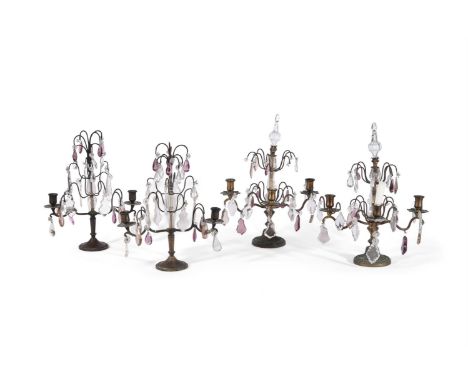 TWO PAIRS OF SIMILAR CUT-GLASS, PATINATED AND GILT METAL CANDELABRAIN THE MANNER OF MAISON JANSEN, EARLY 20TH CENTURYHung wit