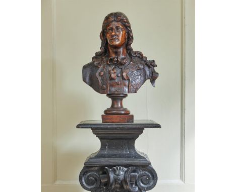 AN ITALIAN CARVED WALNUT PORTRAIT BUST OF A GENTLEMAN17TH CENTURY 48cm high, 33cm wide overall