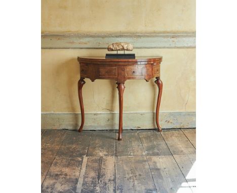 A WALNUT AND CHEVRON STRUNG DEMI-LUNE CARD TABLECIRCA 1710 AND LATERThe hinged top opening to a baize inset playing surface a