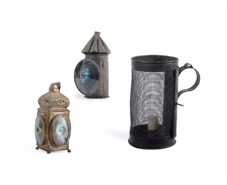TWO PRESSED METAL HAND LANTERNS 18TH CENTURYThe first pressed brass, three light21cm highthe second with single lens19cm high
