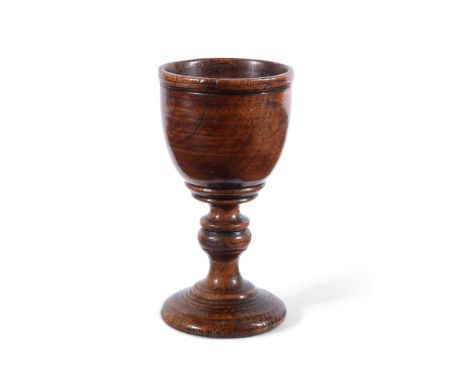 A TREEN GOBLET FIRST HALF 18TH CENTURY15cm high, the base 7.5cm diameterFor a similar but slightly plainer and later example 