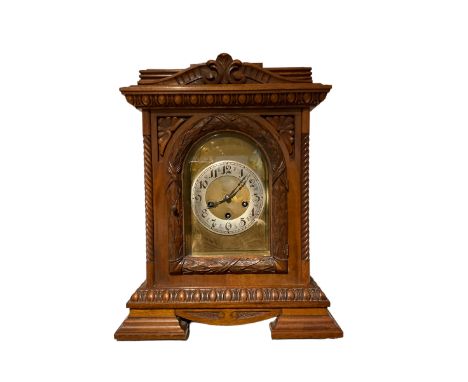 German - early 20th century 8-day chiming mantle clock in a carved oak case, chiming the hours and quarters on 5 gong rods, b