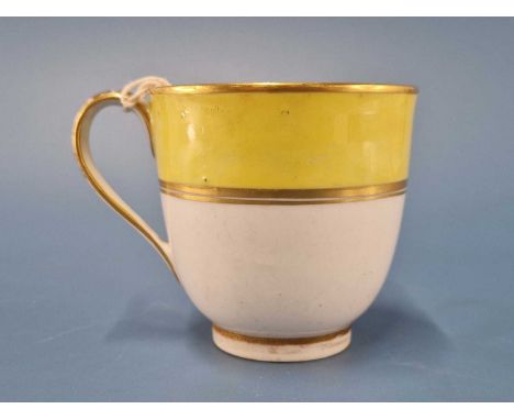 A Derby coffee cup painted with a yellow band within two gilt ones, puce mark and pattern number 473, RF 22This has a peppery