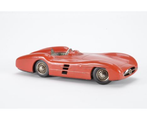 A  JNF Western Germany  tinplate Mercedes W196S Streamline model, in red with friction drive and steering  mechanism, length 