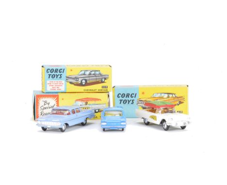 A Corgi Toys 430 Bermuda Taxi, white body, lime green/red canopy, 220 Chevrolet Impala, light blue body, red interior, 229 Ch