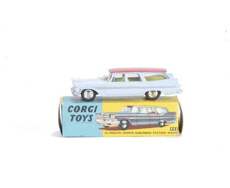 A Corgi Toys 445 Plymouth Sports Suburban Station Wagon, pale blue body, red roof, lemon interior, spun hubs, in original box