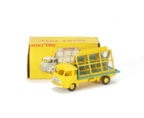 A French Dinky 33c Simca Glazier's Van, yellow cab, chassis and ridged hubs, green flatbed, one plastic and one metal sheet, 