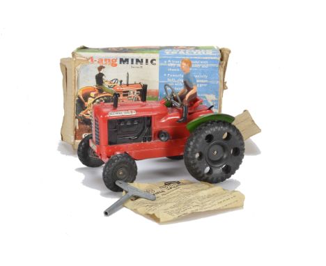 A Tri-ang  Minic clockwork  No2 Nuffield Tractor, in red plastic with green tin wheel arches, Driver, Exhaust Chimney, key an