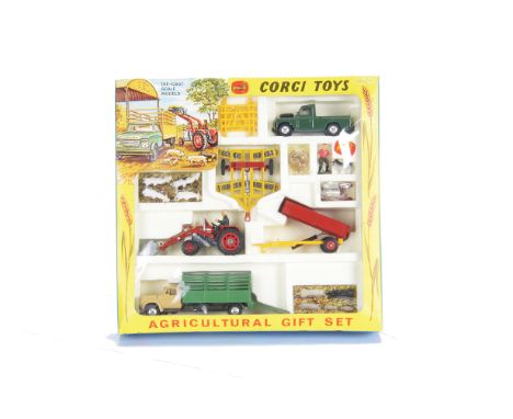 A Corgi Toys Gift Set 5 Agricultural Set, comprising Massey-Ferguson 165 Tractor with shovel, Skip and Churns, Tandem Disc Ha