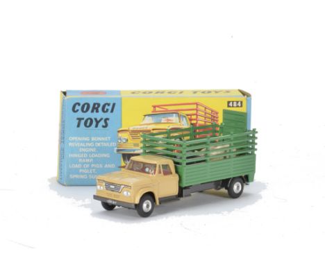 A Corgi Toys 484 Dodge Kew Fargo Livestock Transporter, beige cab, green body, spun hubs, five pigs on card base, in original