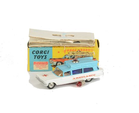 A Corgi Toys 437 Cadillac Superior Ambulance, light blue over white body, 'Ambulance' on sides, red roof light, spun hubs, in